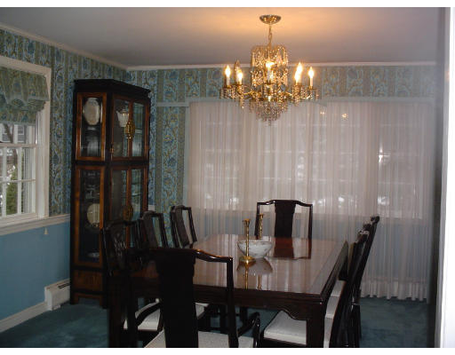 122 Kendall Road Lexington, MA 02421 - Photo 4 of 15 a view of a dining room with furniture and chandelier