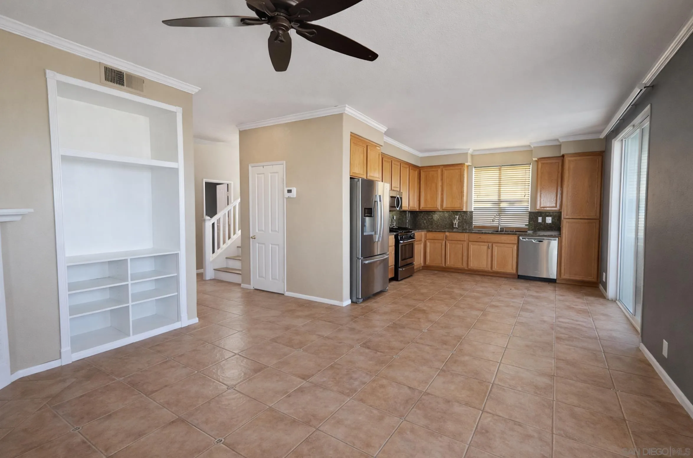 700 Rocking Horse Drive Chula Vista, CA 91914 - Photo 12 of 25 a view of a kitchen with refrigerator and window