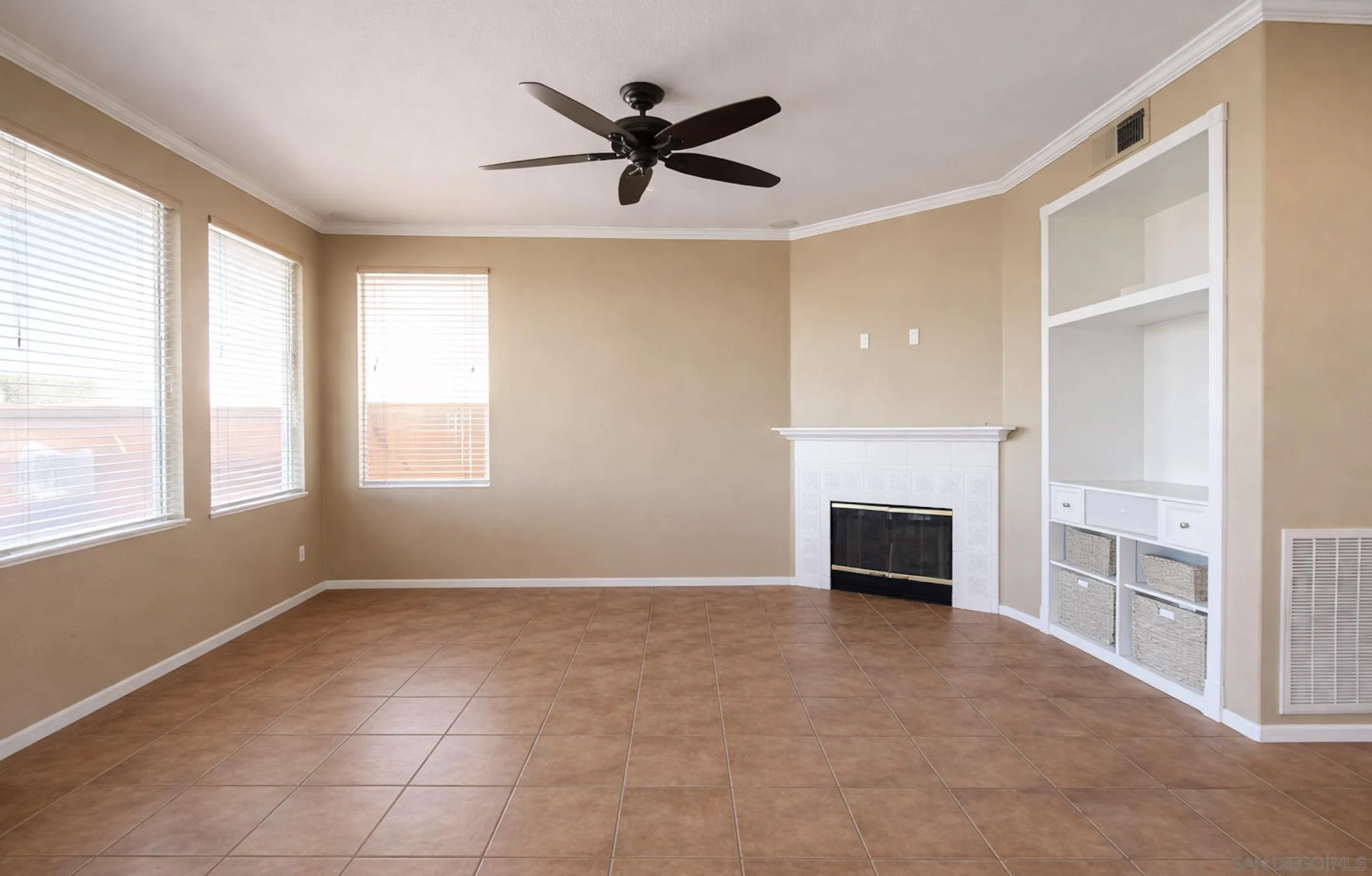 700 Rocking Horse Drive Chula Vista, CA 91914 - Photo 13 of 25 a view of an empty room with a fireplace and a window
