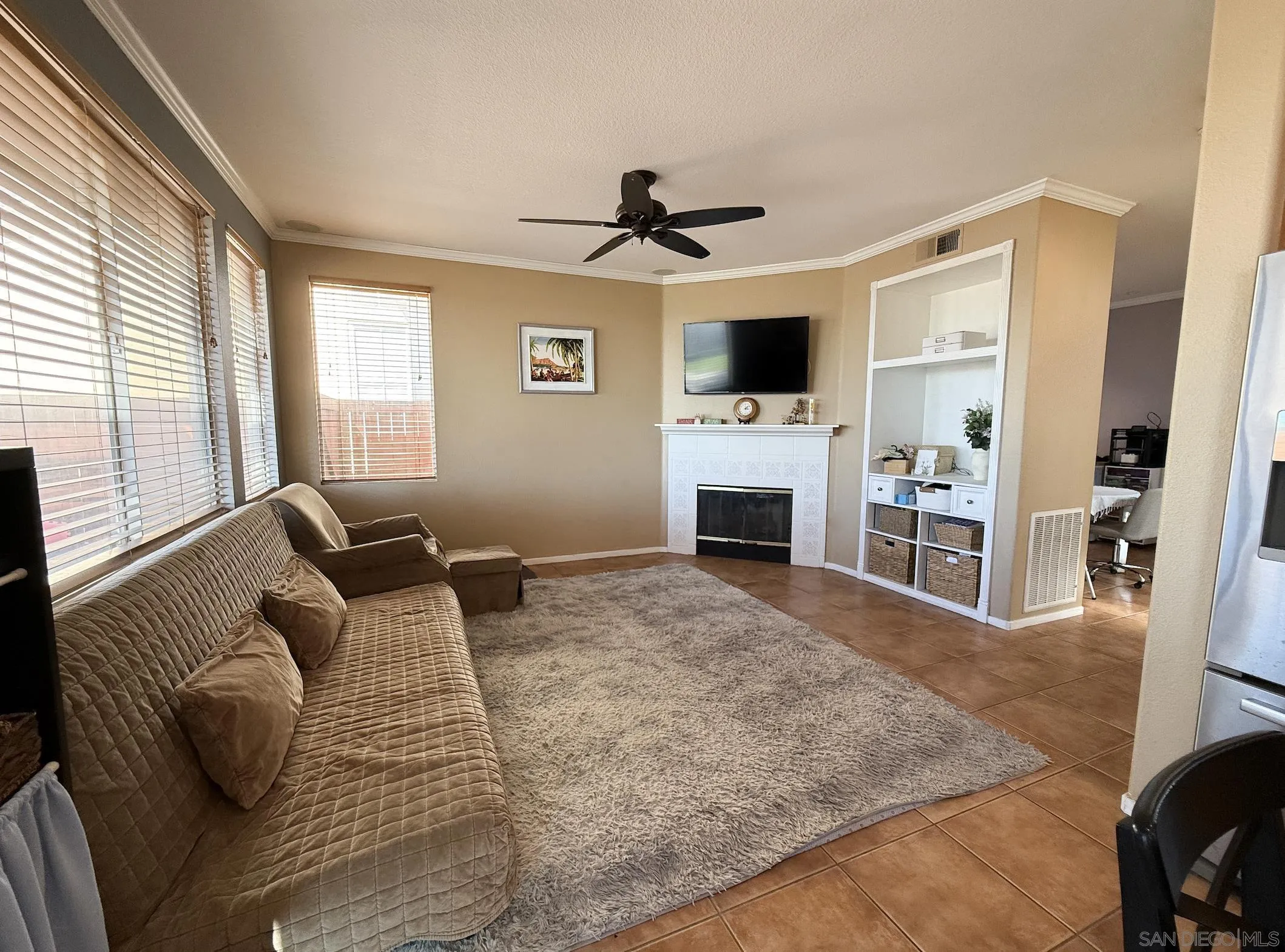 700 Rocking Horse Drive Chula Vista, CA 91914 - Photo 15 of 25 a living room with furniture and a flat screen tv