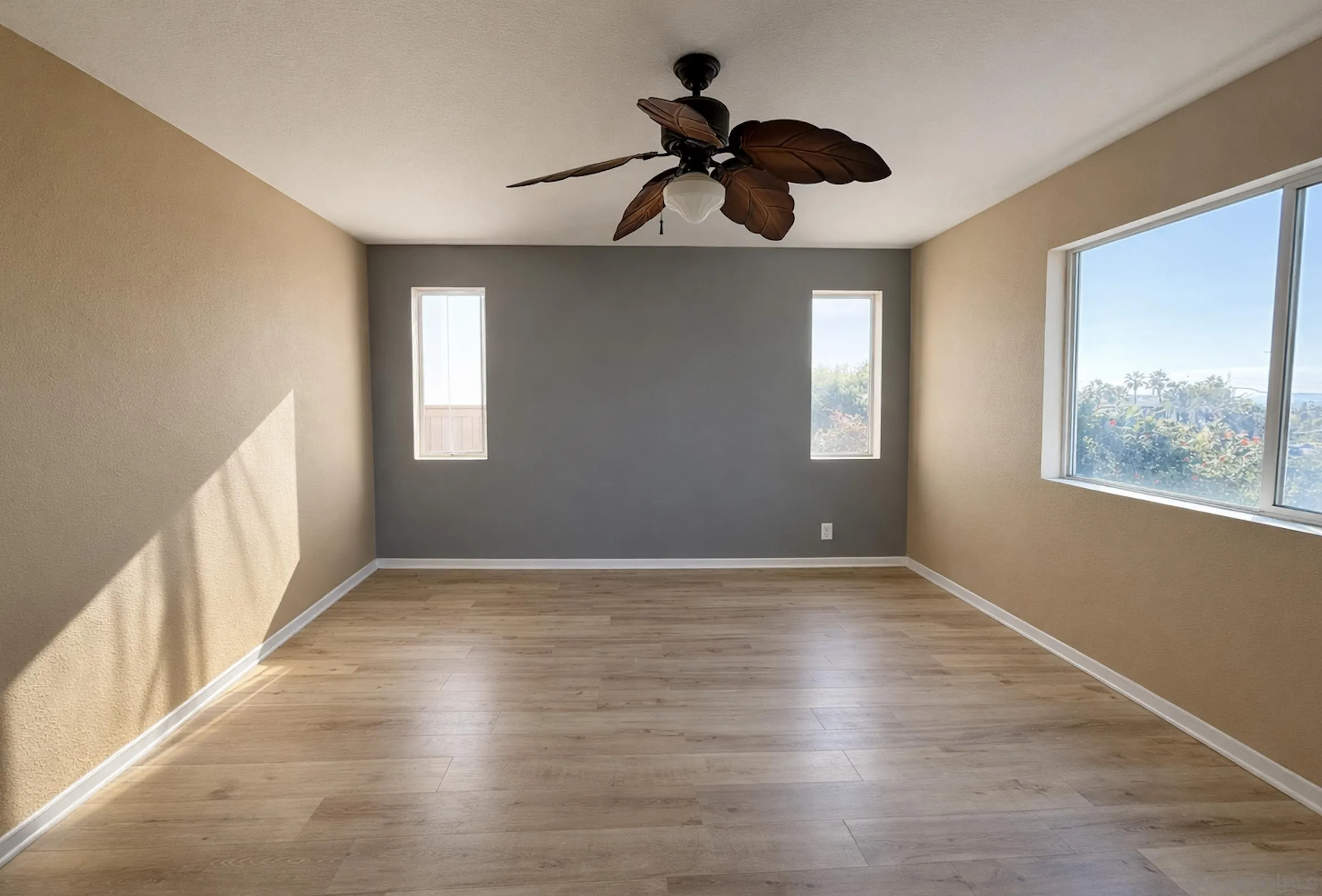 700 Rocking Horse Drive Chula Vista, CA 91914 - Photo 18 of 25 a view of an empty room window and wooden floor