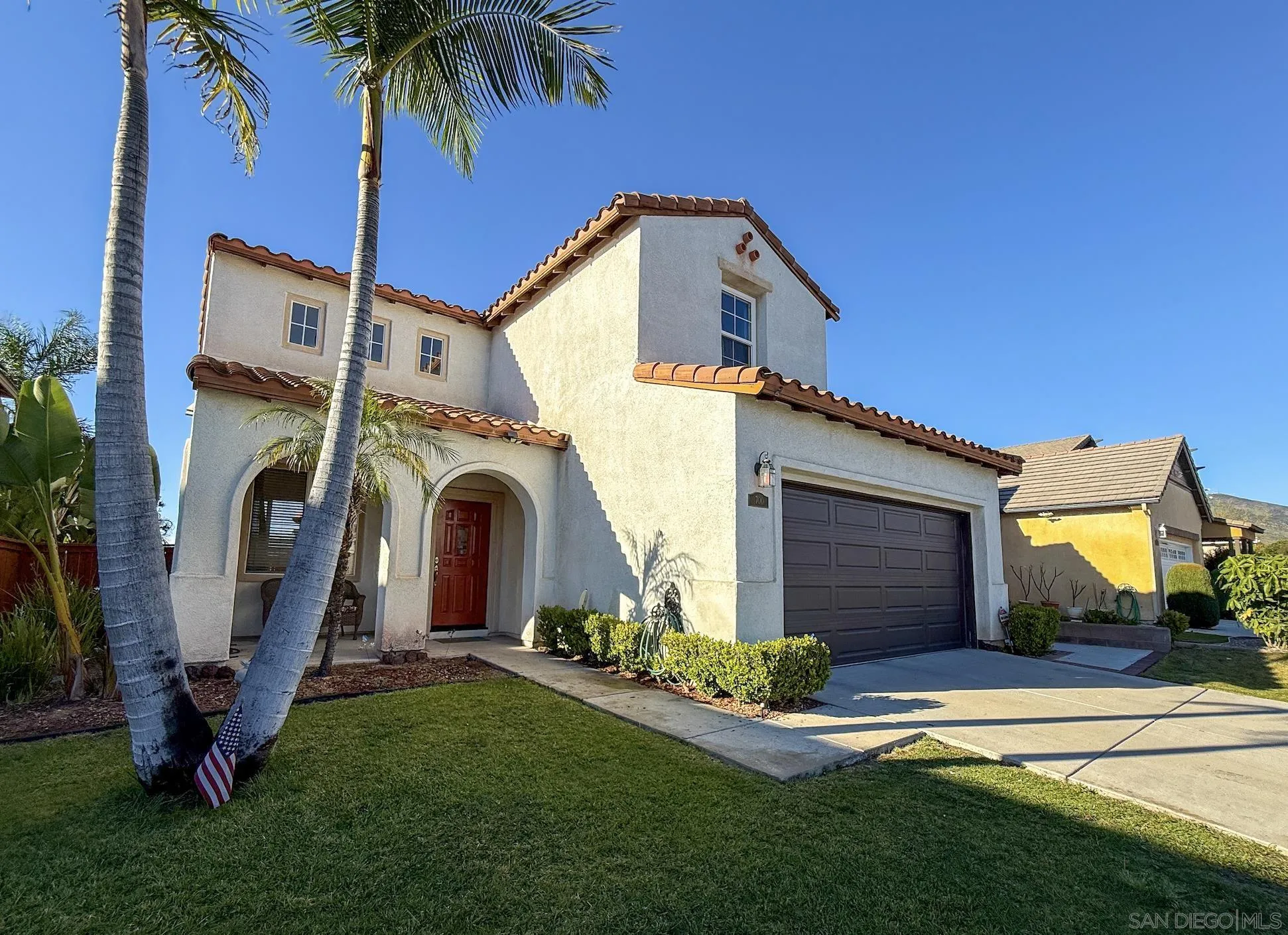 700 Rocking Horse Drive Chula Vista, CA 91914 - Photo 2 of 25 a front view of a house with a garden and plants