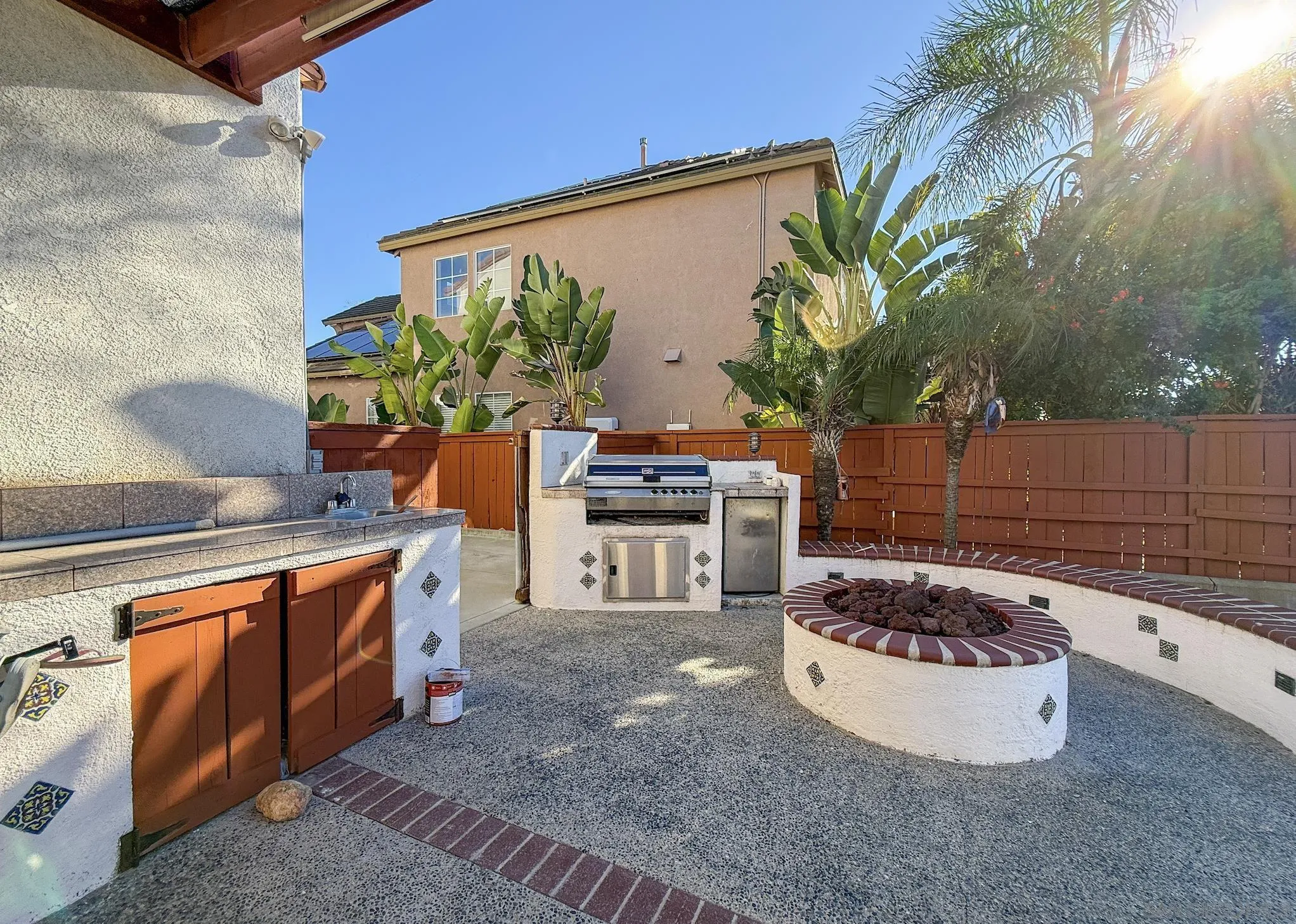 700 Rocking Horse Drive Chula Vista, CA 91914 - Photo 4 of 25 a view of a backyard with table and chairs and a barbeque