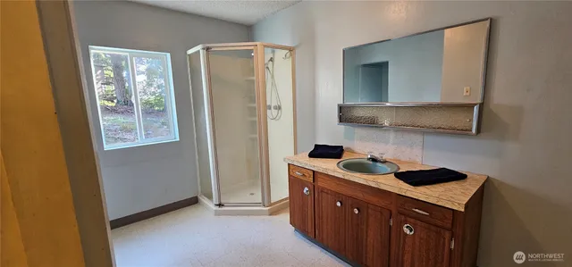 a kitchen with a sink and cabinets