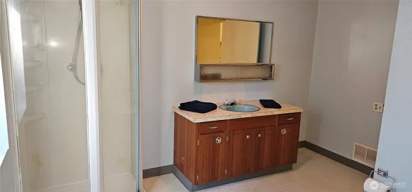 a view of an empty room with windows