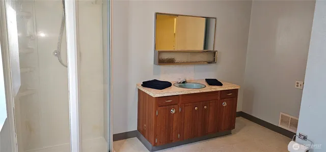 a view of an empty room with windows