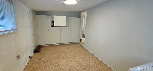 an empty room that has a window