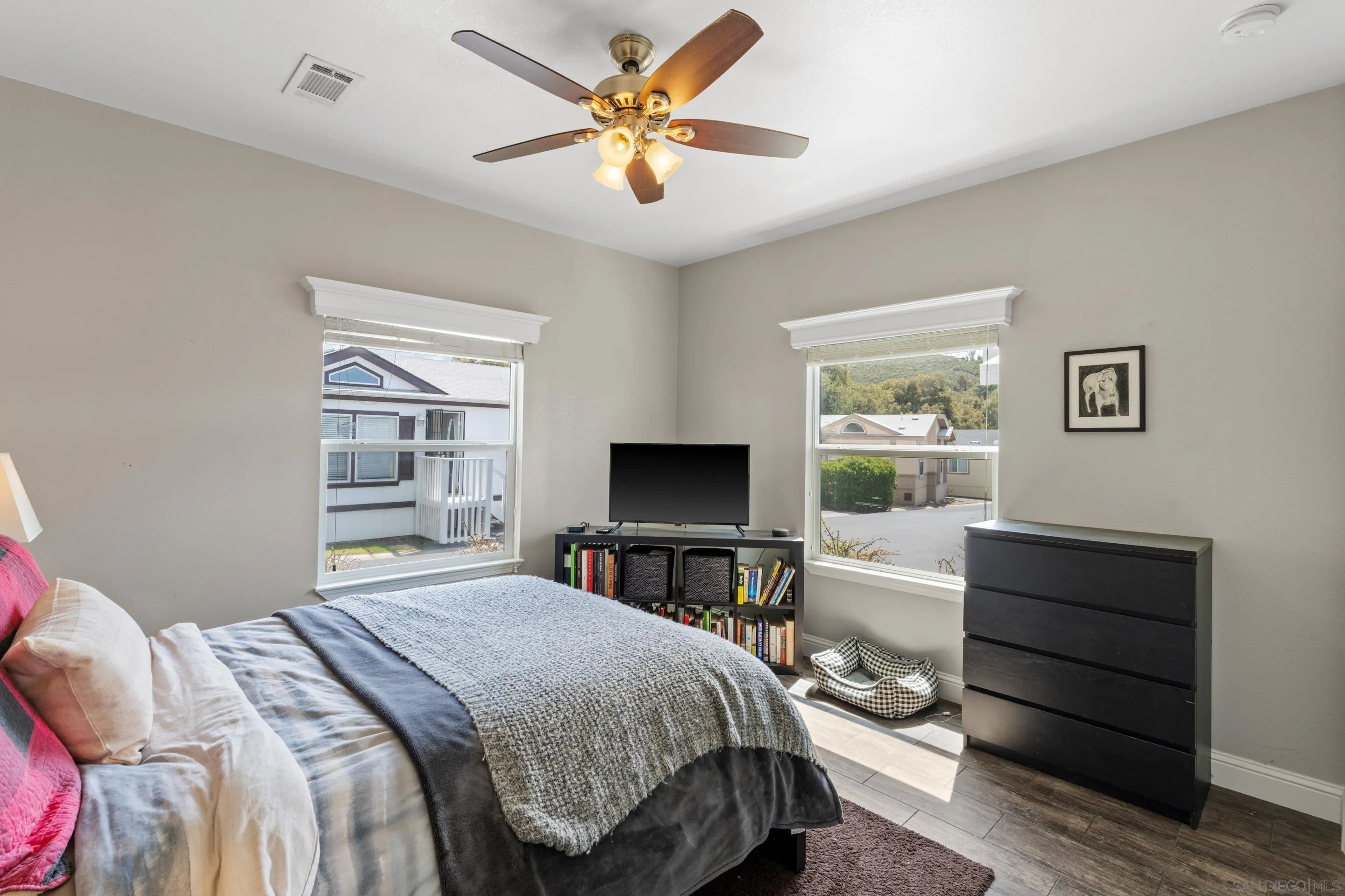 3505 Alpine Boulevard, Unit 1 Alpine, CA 91901 - Photo 13 of 27 a bedroom with a bed and a chandelier