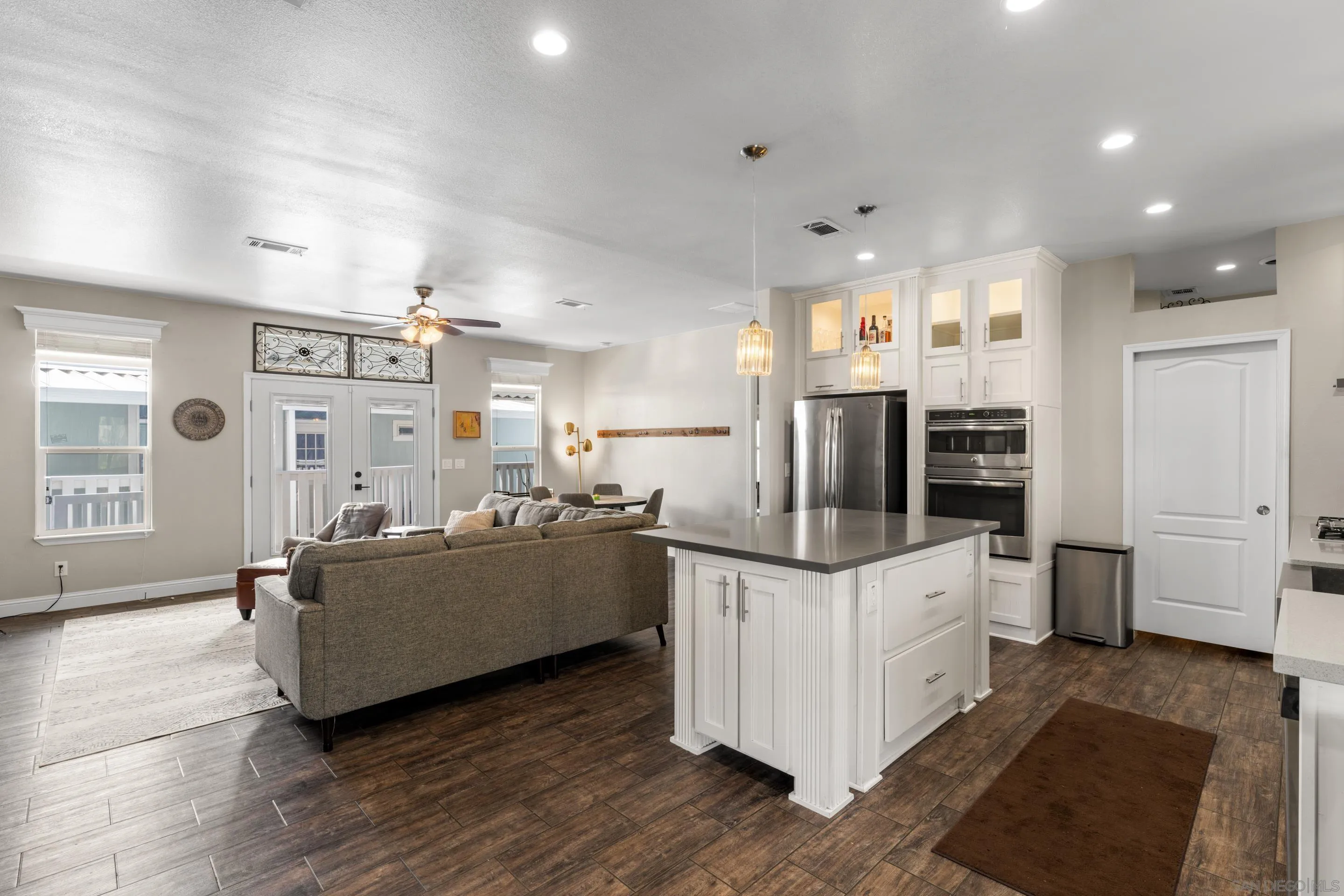3505 Alpine Boulevard, Unit 1 Alpine, CA 91901 - Photo 16 of 27 a kitchen with stainless steel appliances kitchen island granite countertop a stove and a refrigerator