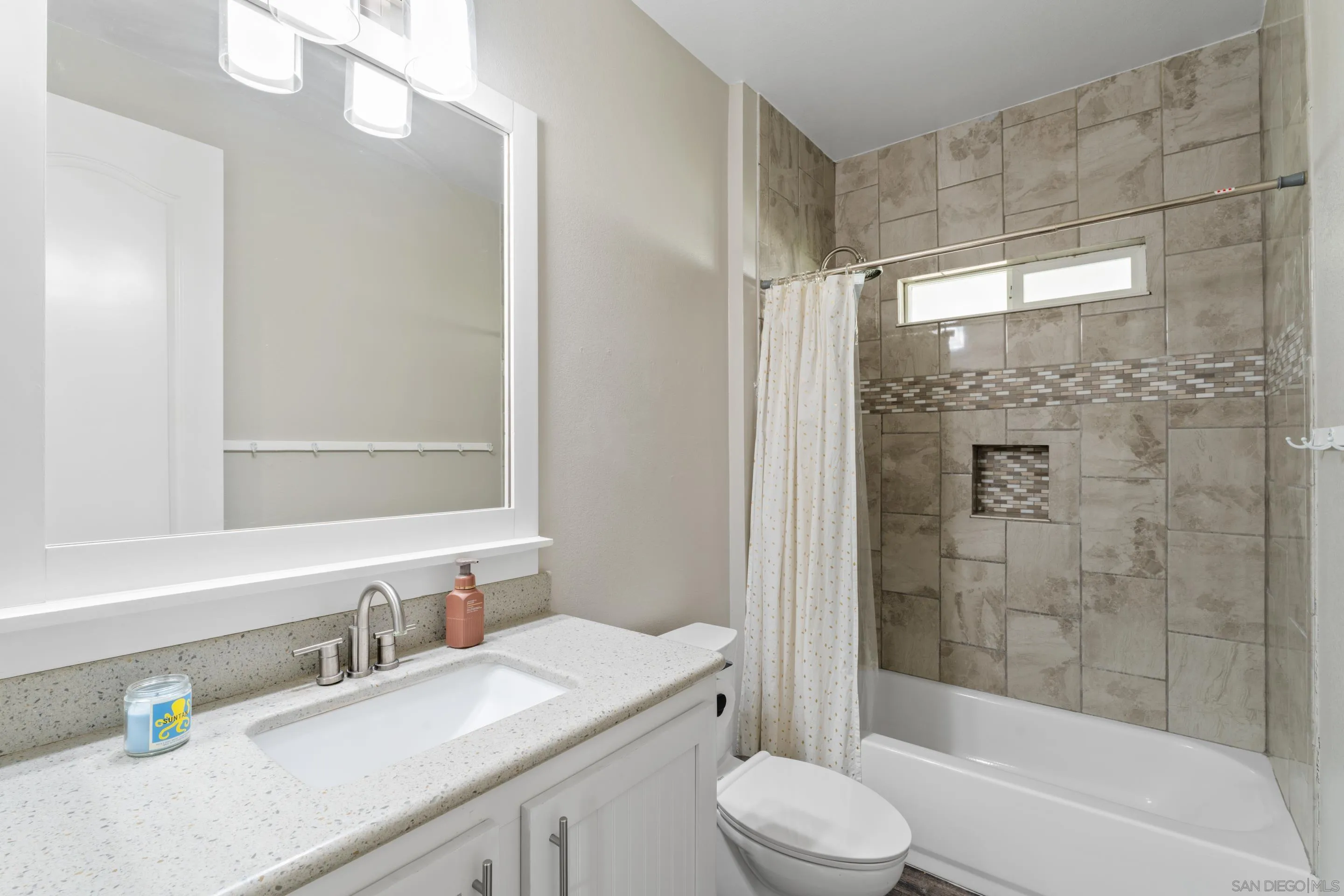 3505 Alpine Boulevard, Unit 1 Alpine, CA 91901 - Photo 22 of 27 a bathroom with a granite countertop bathtub sink vanity mirror and toilet