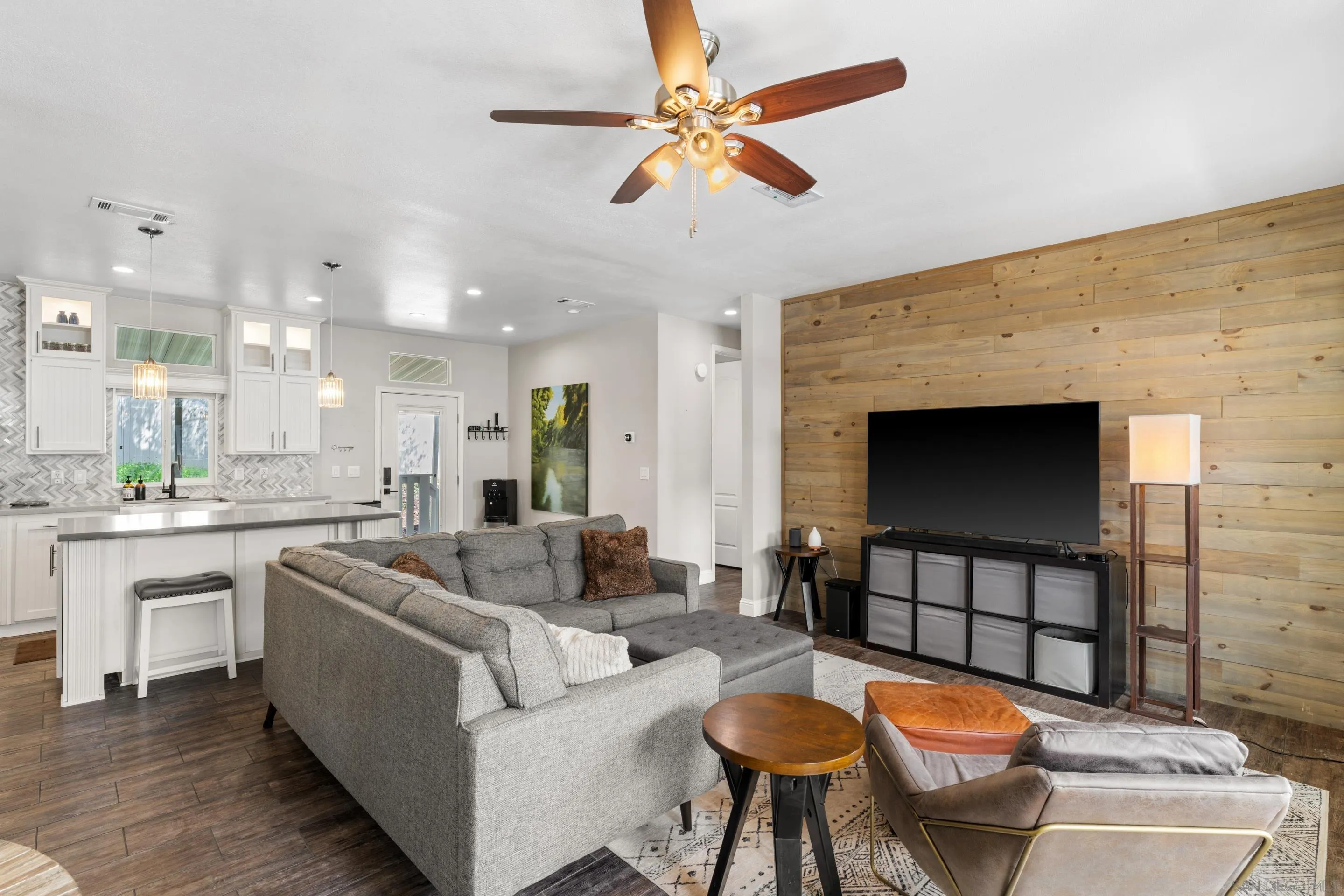 3505 Alpine Boulevard, Unit 1 Alpine, CA 91901 - Photo 3 of 27 a living room with furniture a fireplace and a flat screen tv
