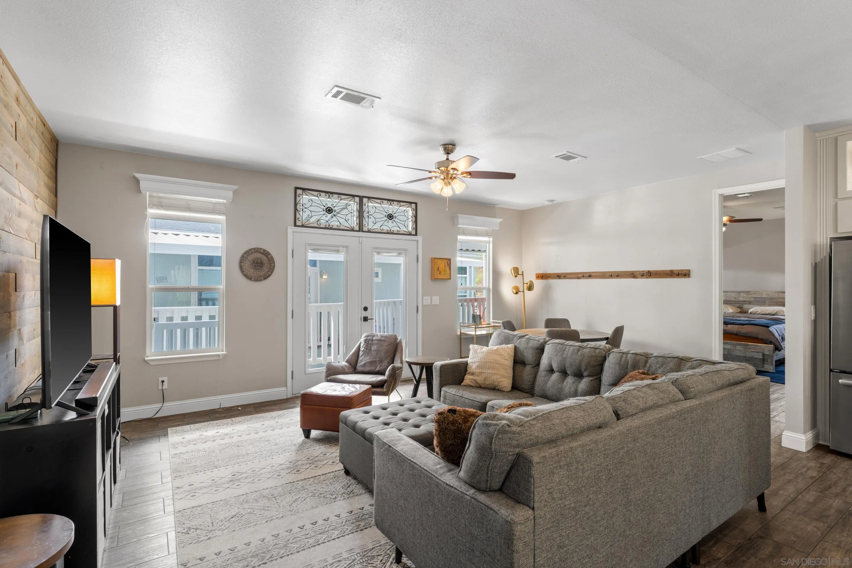 3505 Alpine Boulevard, Unit 1 Alpine, CA 91901 - Photo 5 of 27 a living room with furniture and a flat screen tv