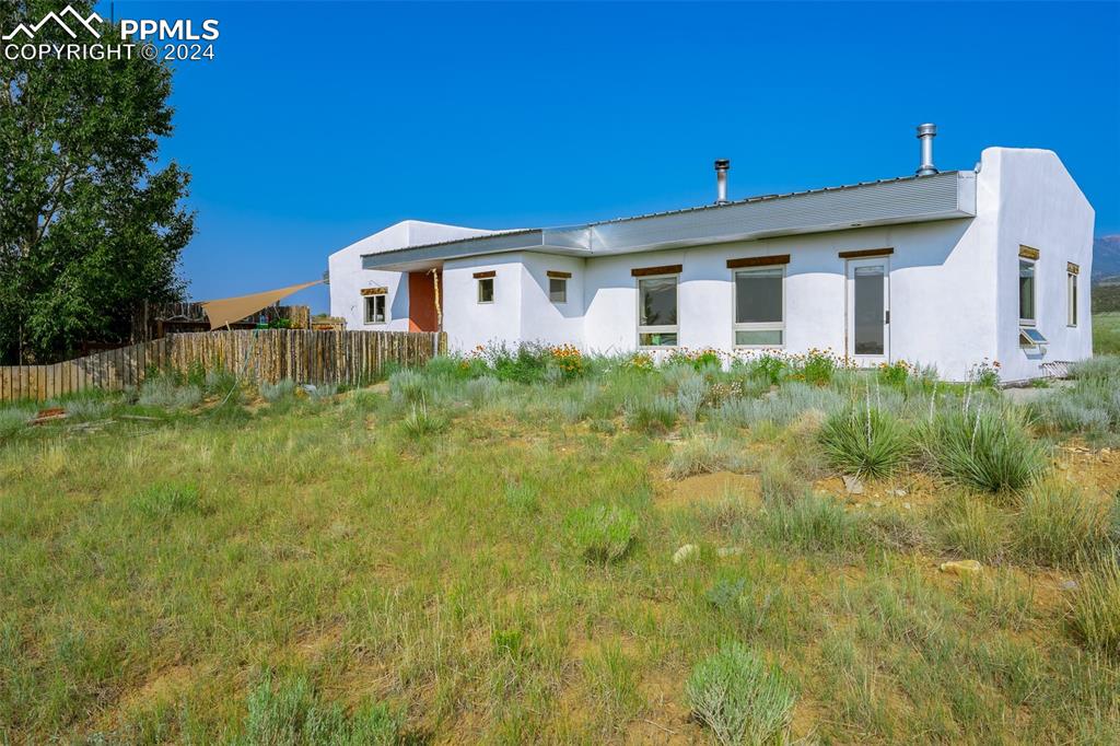 54309 County Rd LL56 Villa Grove, CO 81155 - Photo 2 of 43 a front view of a house with a yard