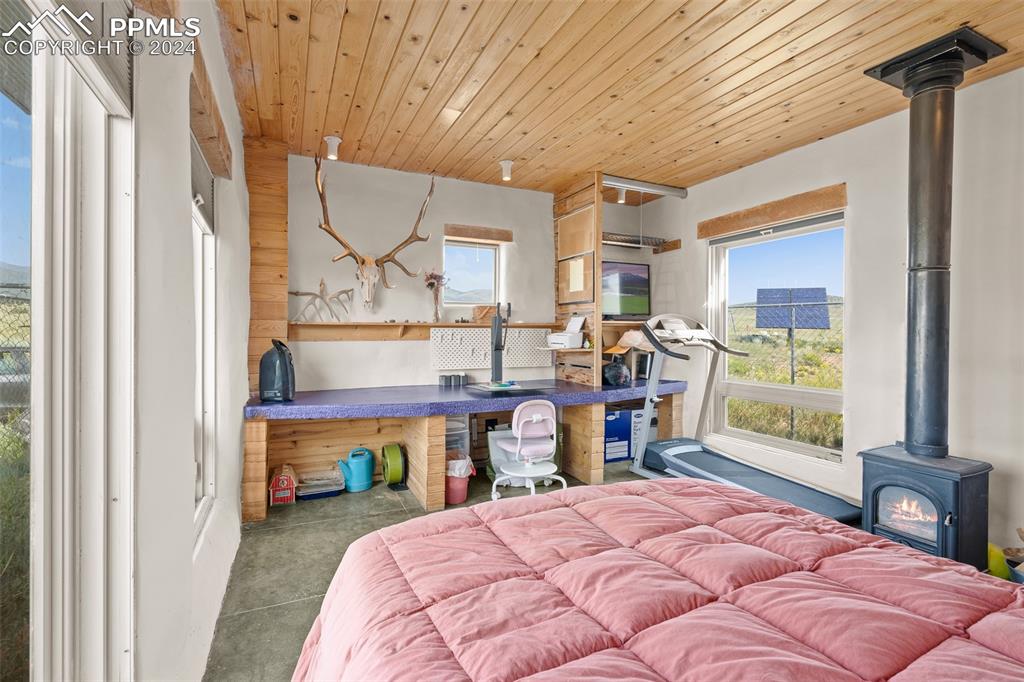 54309 County Rd LL56 Villa Grove, CO 81155 - Photo 30 of 43 a bed room with a bed and a table