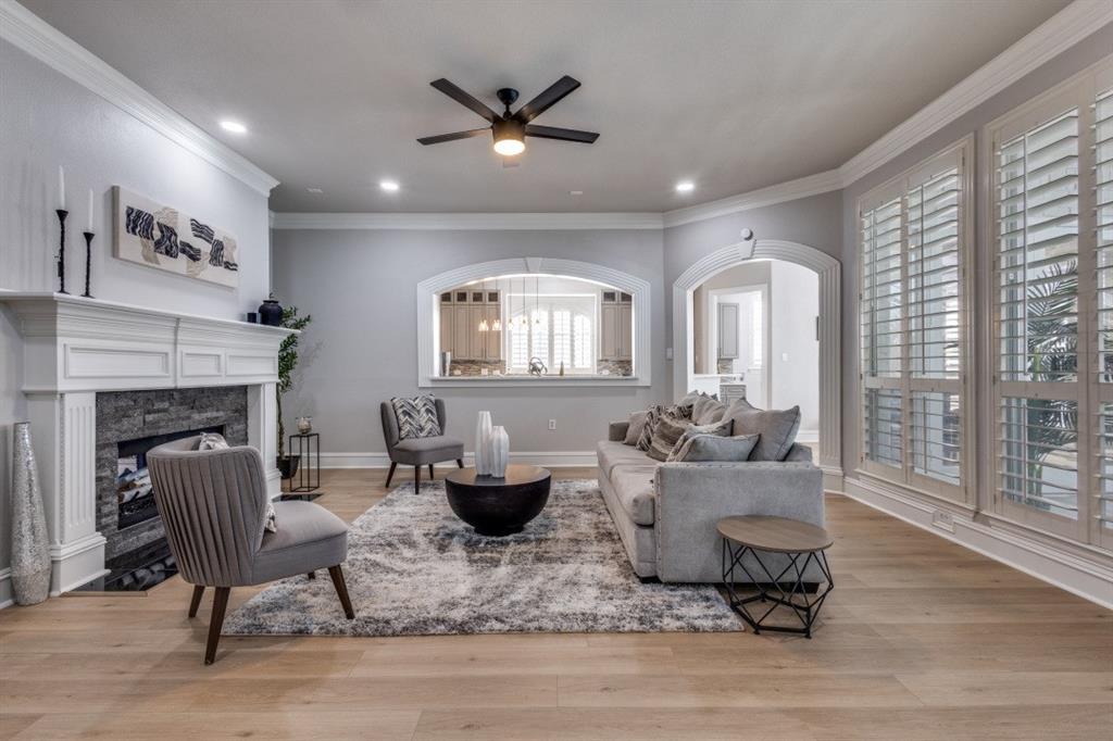 3512 Provine Road McKinney, TX 75072 - Photo 19 of 33 a living room with furniture and a fireplace