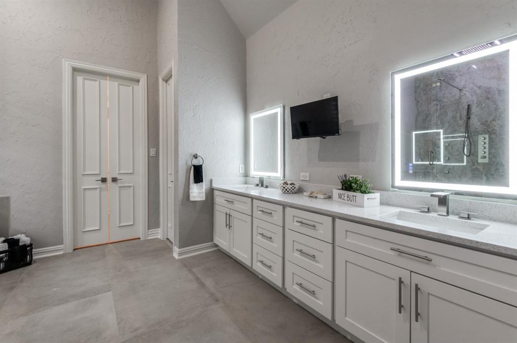 3512 Provine Road McKinney, TX 75072 - Photo 21 of 33 a spacious bathroom with a double vanity sink and a mirror