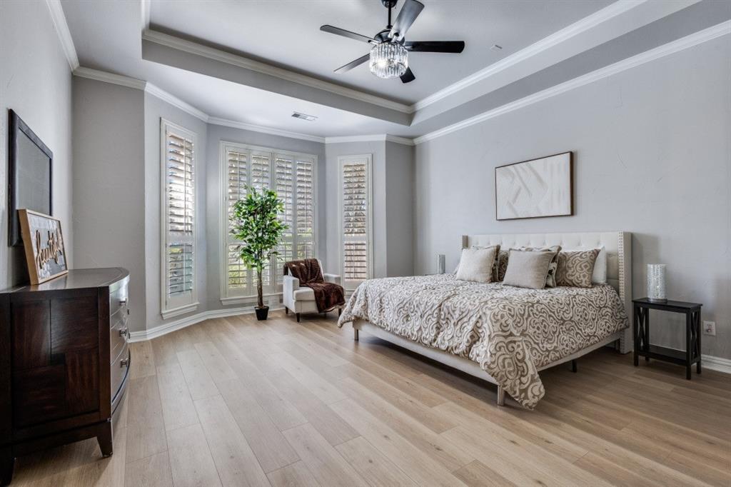 3512 Provine Road McKinney, TX 75072 - Photo 22 of 33 a spacious bedroom with a bed a couch and a large window
