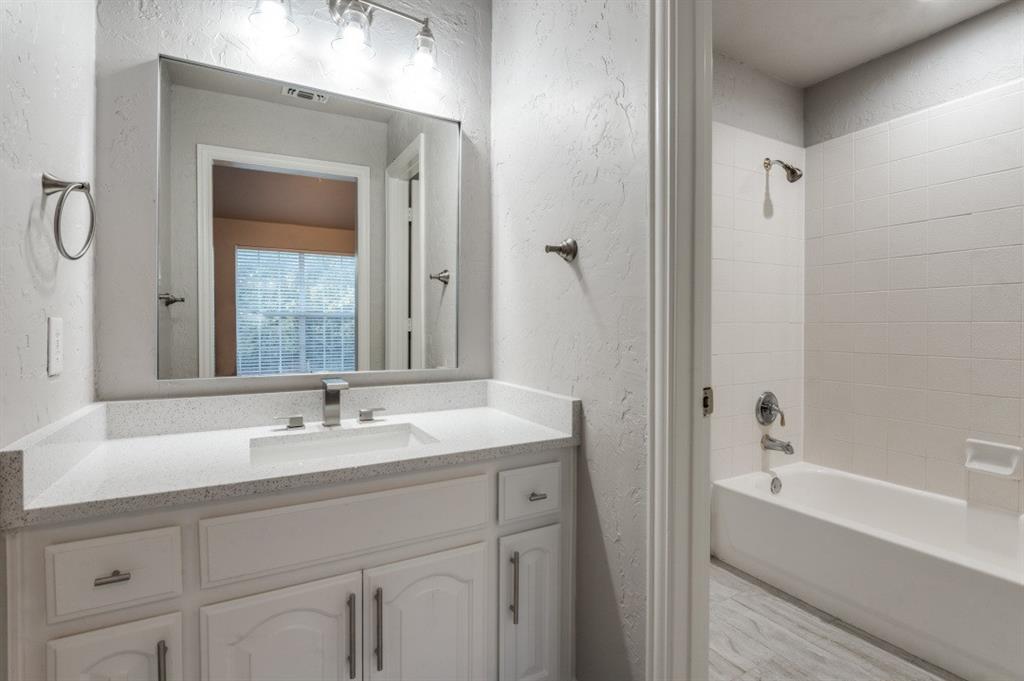 3512 Provine Road McKinney, TX 75072 - Photo 26 of 33 a bathroom with a tub sink and mirror