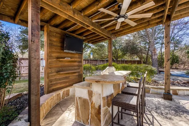 a view of balcony with table and chairs