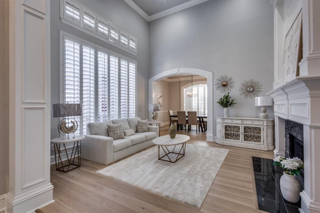 3512 Provine Road McKinney, TX 75072 - Photo 10 of 33 a living room with furniture a fireplace and a large window