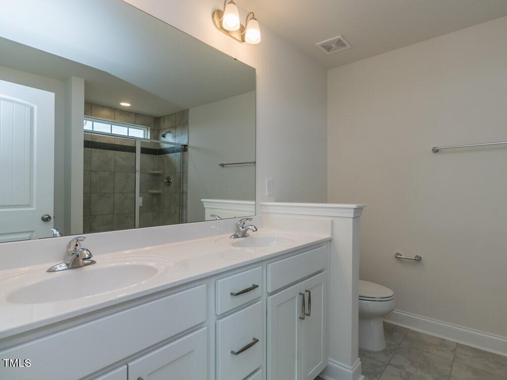 937 Channel Drop Loop Zebulon, NC 27597 - Photo 16 of 22 016_ Master Bathroom