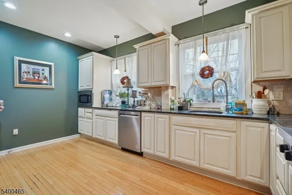 a kitchen with a sink cabinets and window