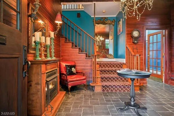 a backyard of a house with barbeque oven table and chairs