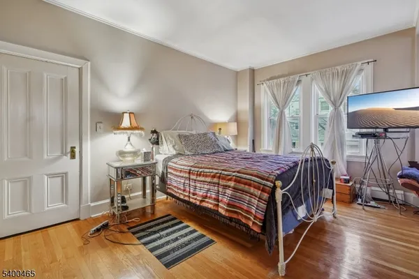 a bedroom with a bed and a table in it