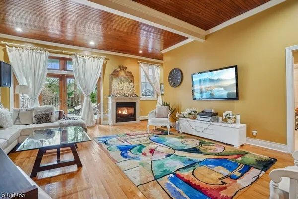 a living room with furniture a rug and a fireplace