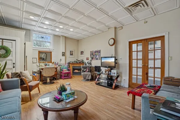 a living room with furniture window and wooden floor