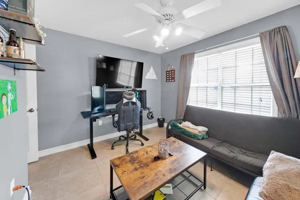 a living room with furniture rug and window