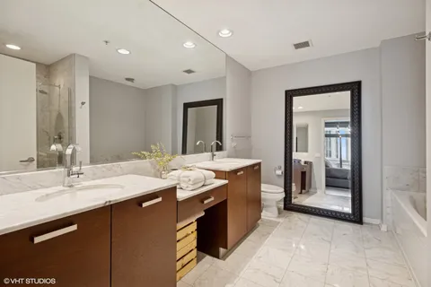 a bathroom with a sink double vanity and a mirror