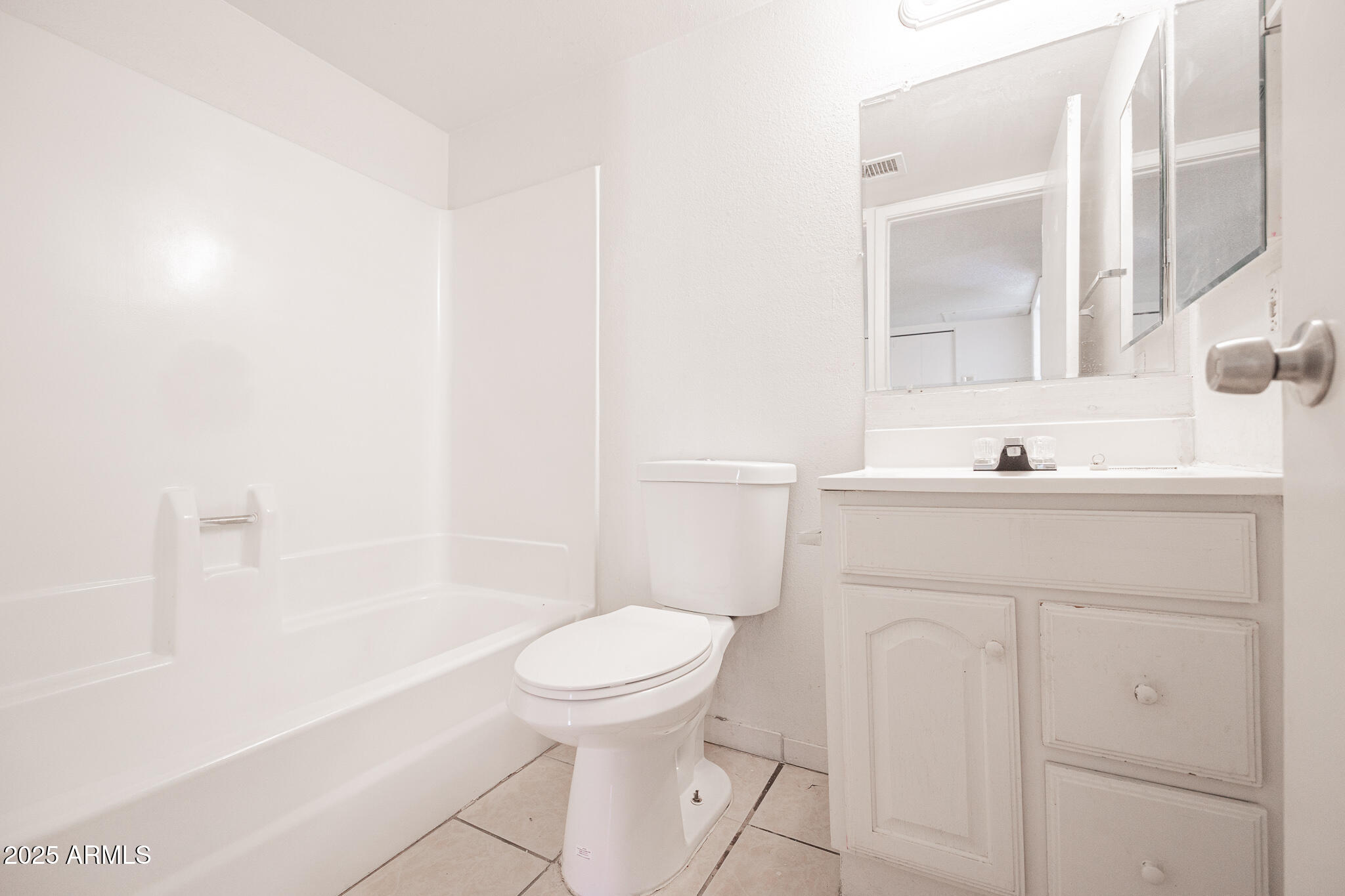 2802 North 43rd Avenue, Unit B Phoenix, AZ 85009 - Photo 15 of 18 a bathroom with a sink toilet and shower