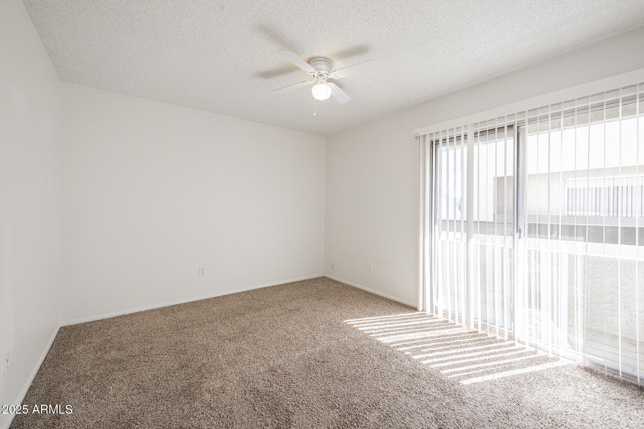 2802 North 43rd Avenue, Unit B Phoenix, AZ 85009 - Photo 9 of 18 wooden floor in an empty room with a window