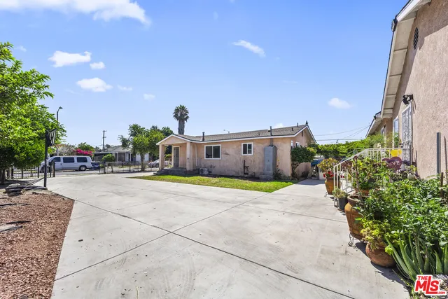 a front view of a house with a yard and a garage