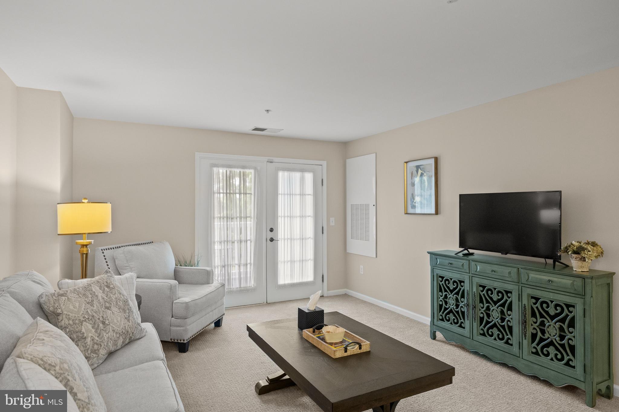 170 East Greentree Road, Unit 2232 Marlton, NJ 08053 - Photo 12 of 41 a living room with furniture and a flat screen tv