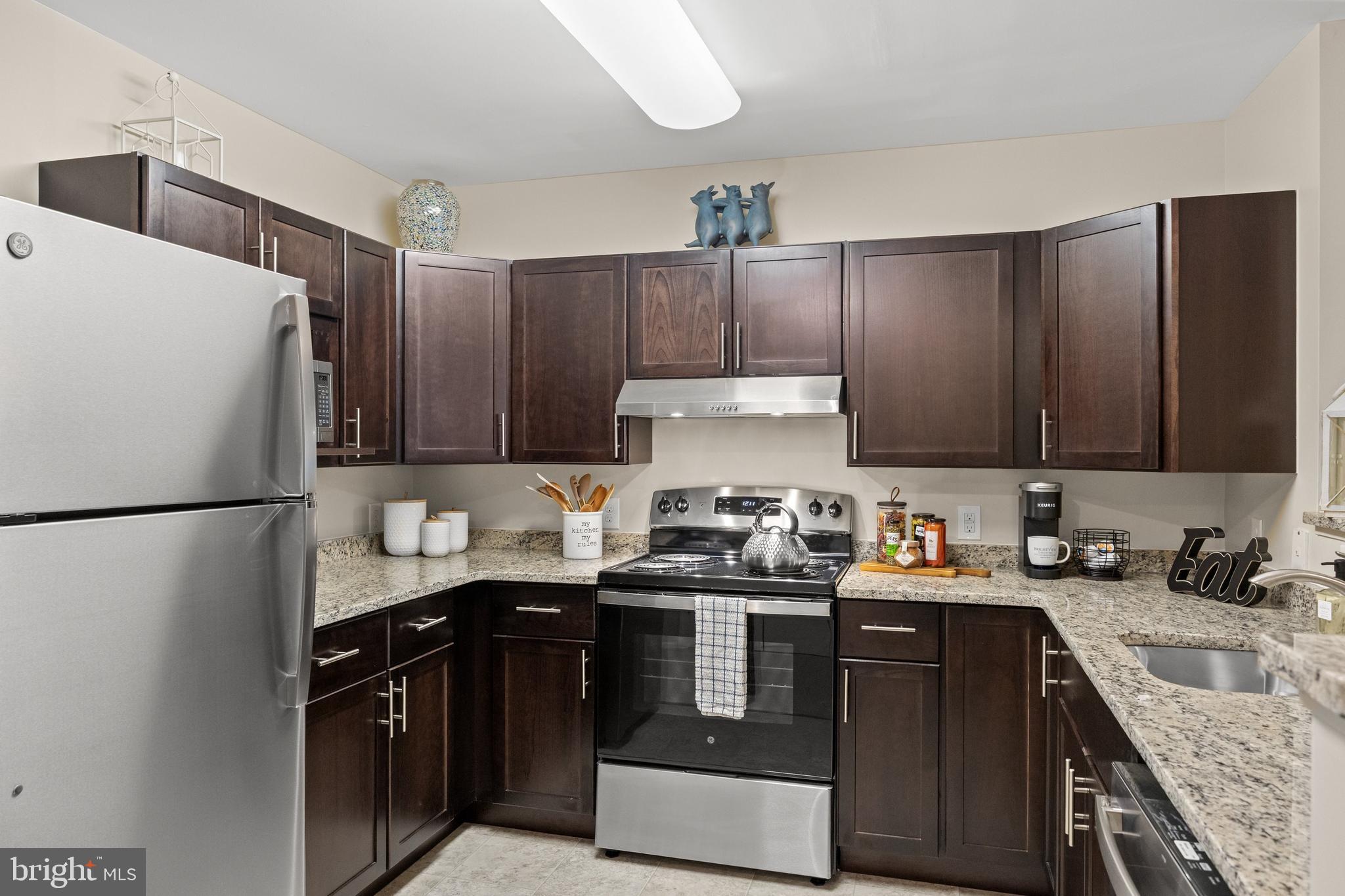 170 East Greentree Road, Unit 2232 Marlton, NJ 08053 - Photo 16 of 41 a kitchen with stainless steel appliances a sink a stove a refrigerator and cabinets
