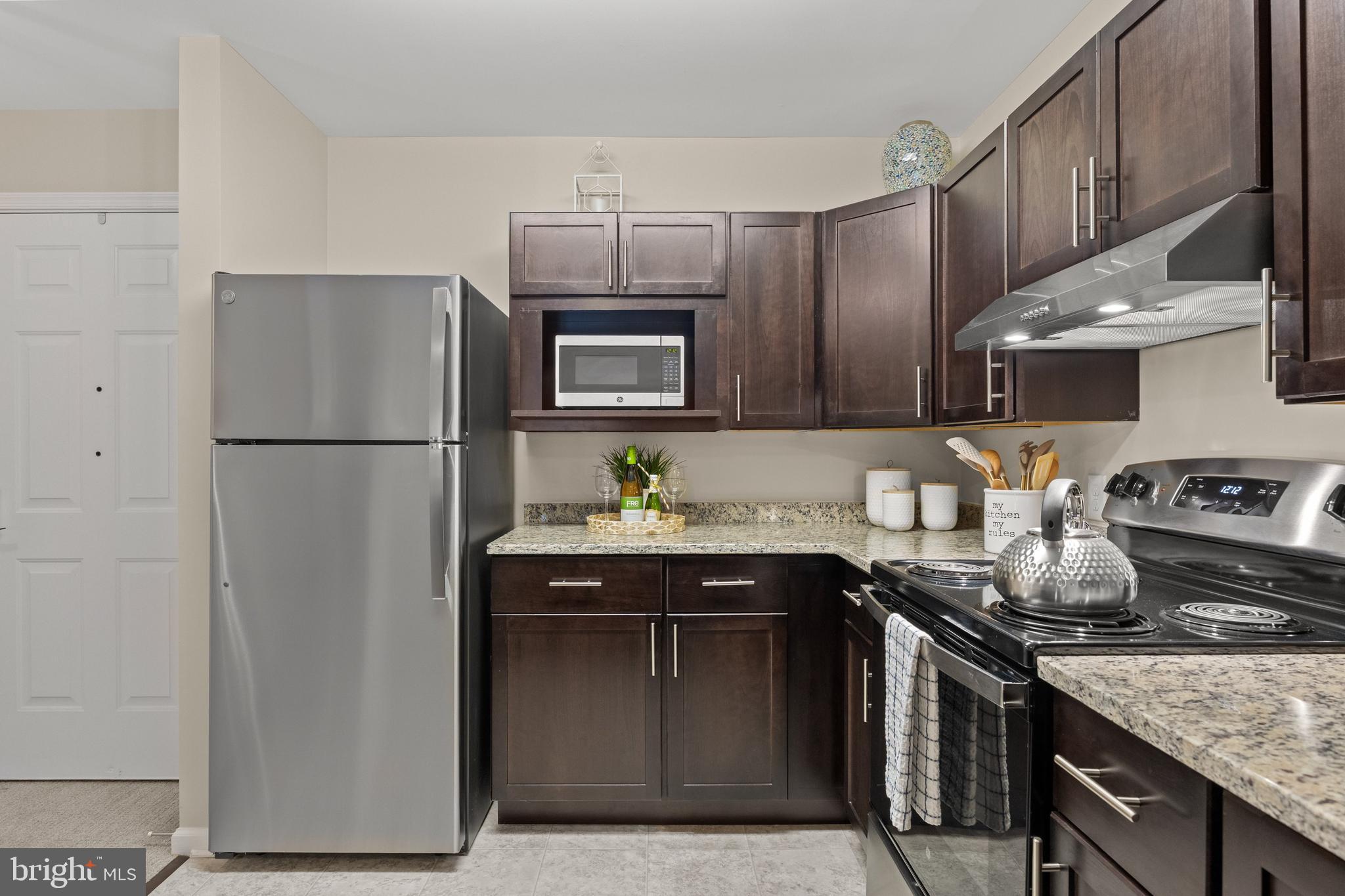 170 East Greentree Road, Unit 2232 Marlton, NJ 08053 - Photo 17 of 41 a kitchen with stainless steel appliances granite countertop a sink stove and refrigerator