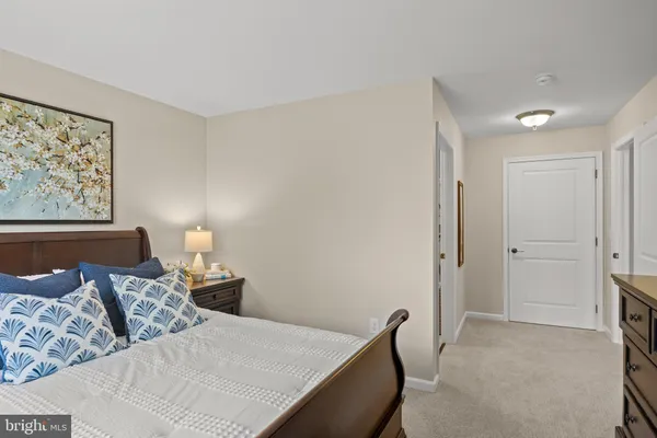 a bed room with furniture and a lamp