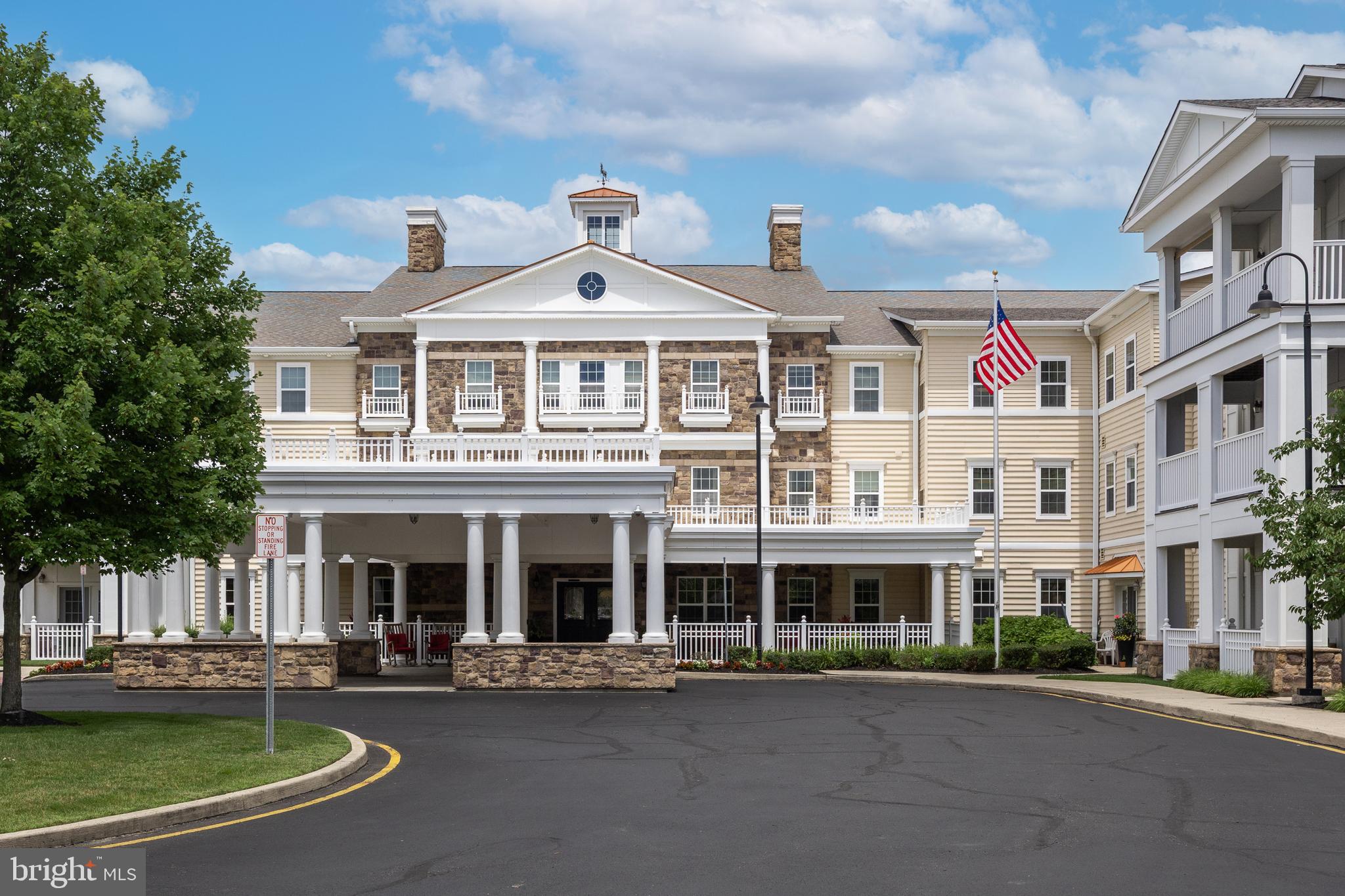 170 East Greentree Road, Unit 2232 Marlton, NJ 08053 - Photo 2 of 41 a front view of a building with a garden and plants
