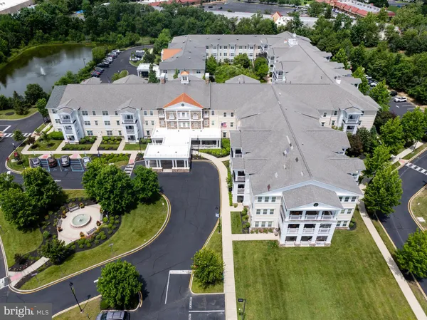 an aerial view of multiple houses with outdoor space