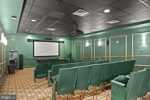 a room with lots of chairs and a projector