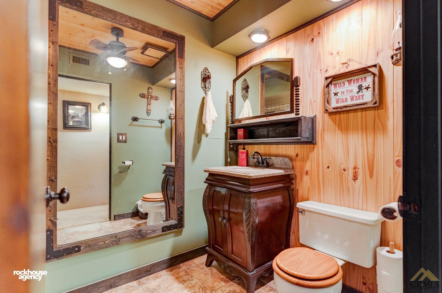 Undisclosed Address Bakersfield, CA 93308 - Photo 12 of 22 a bathroom with a toilet a sink and a shower