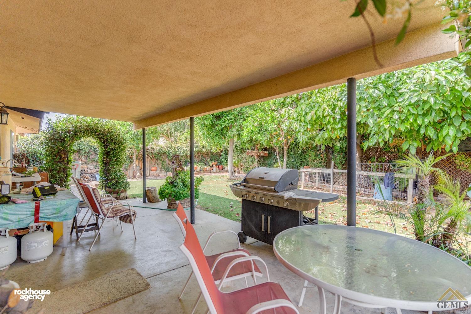 Undisclosed Address Bakersfield, CA 93308 - Photo 19 of 22 a outdoor space with a table and chairs