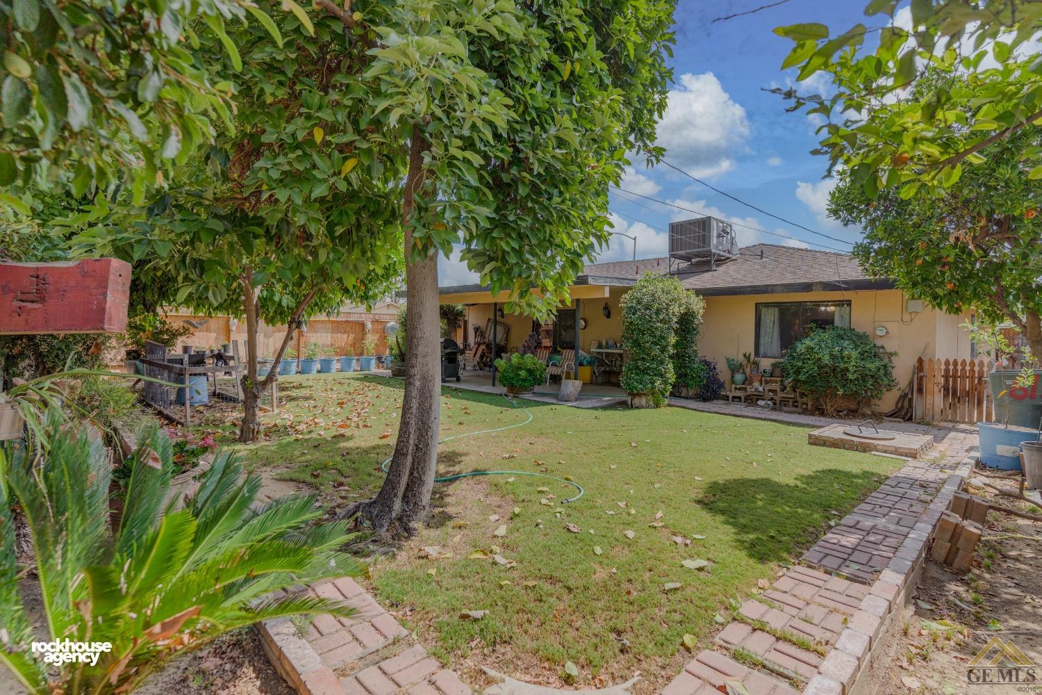Undisclosed Address Bakersfield, CA 93308 - Photo 22 of 22 front view of a house with a yard