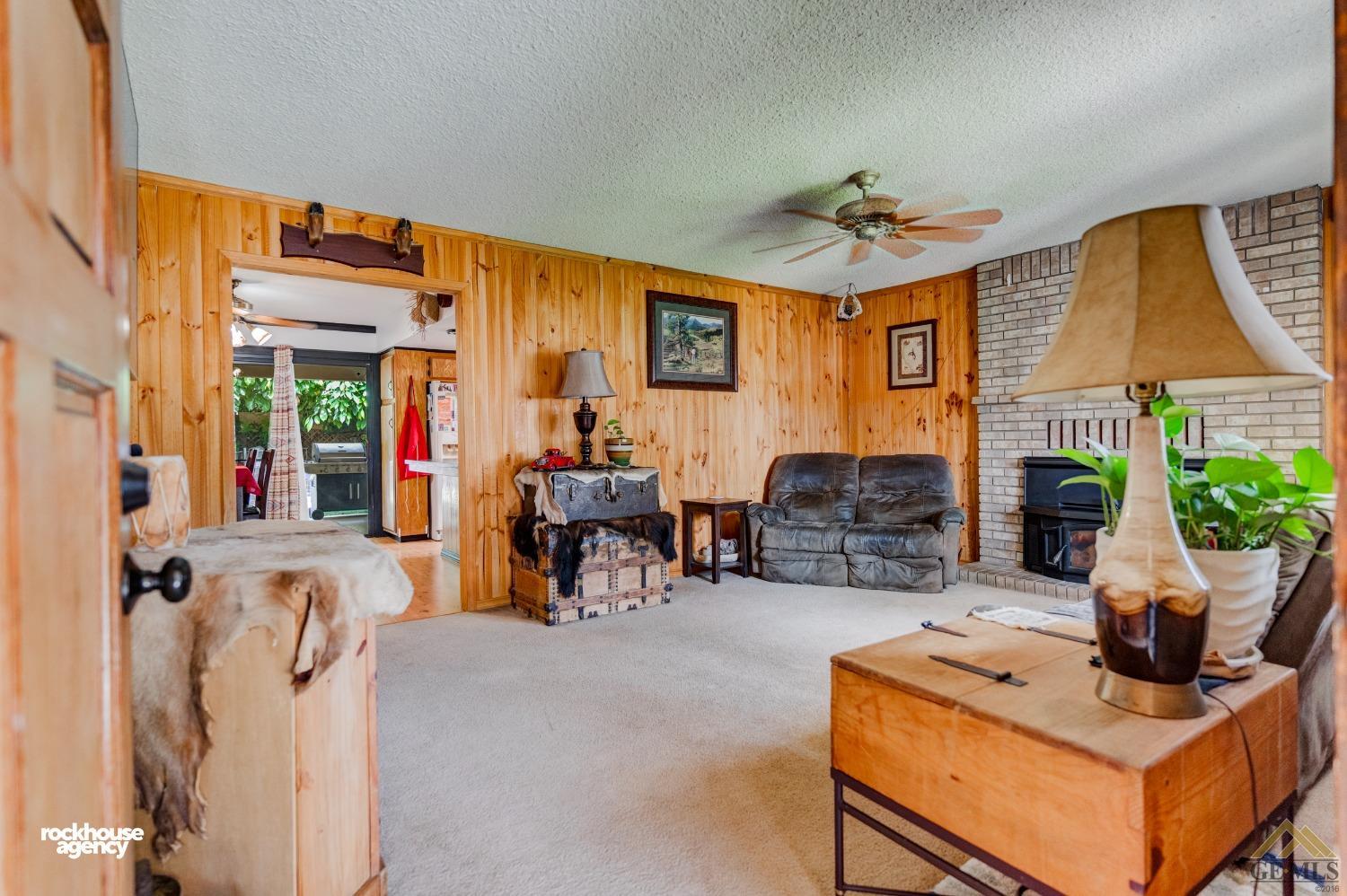 Undisclosed Address Bakersfield, CA 93308 - Photo 4 of 22 a living room with furniture a window and a flat screen tv