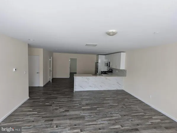 a view of a kitchen with a sink and a stove top oven