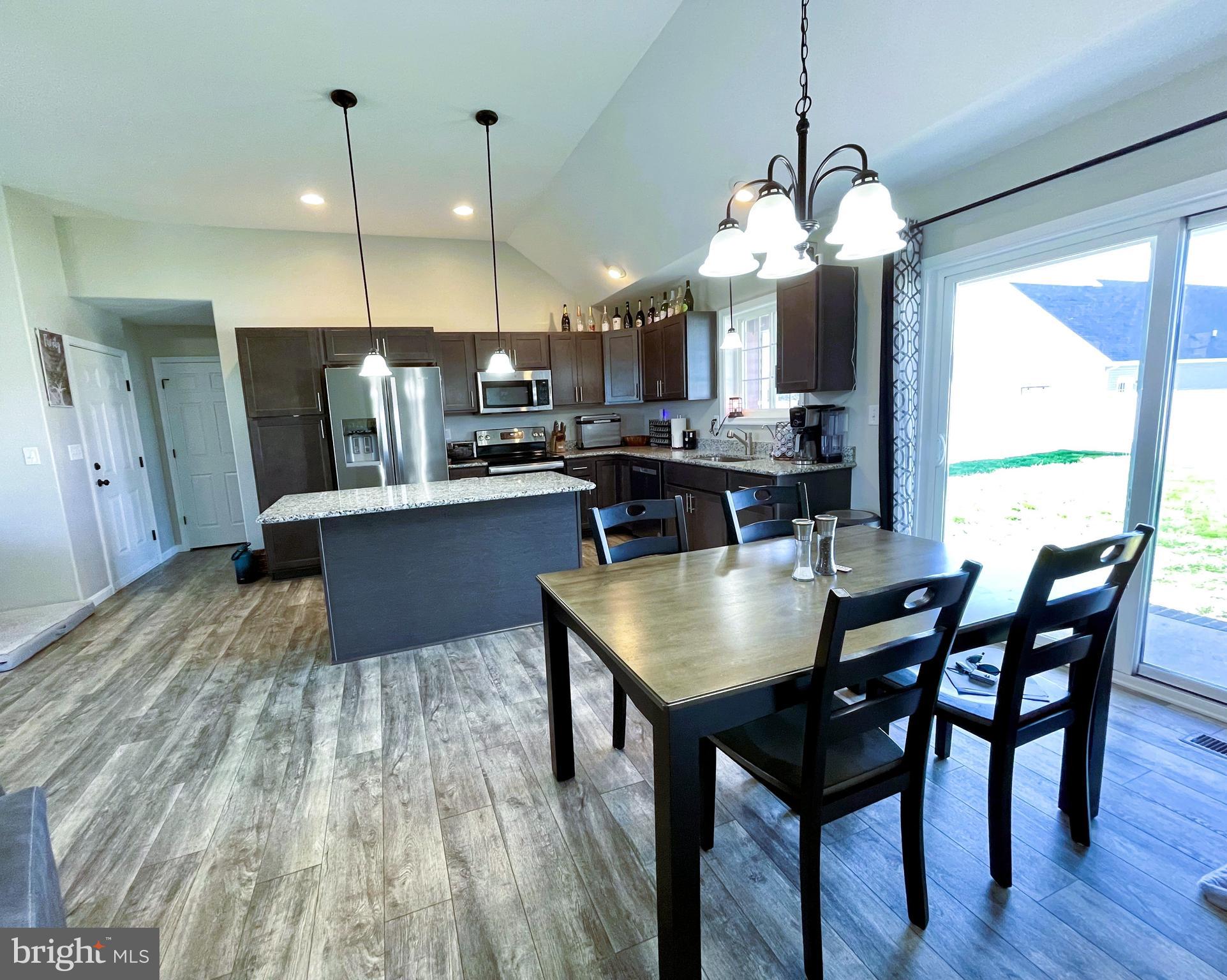 29389 Eagle Point Drive Seaford, DE 19973 - Photo 14 of 42 a large kitchen with a table and chairs