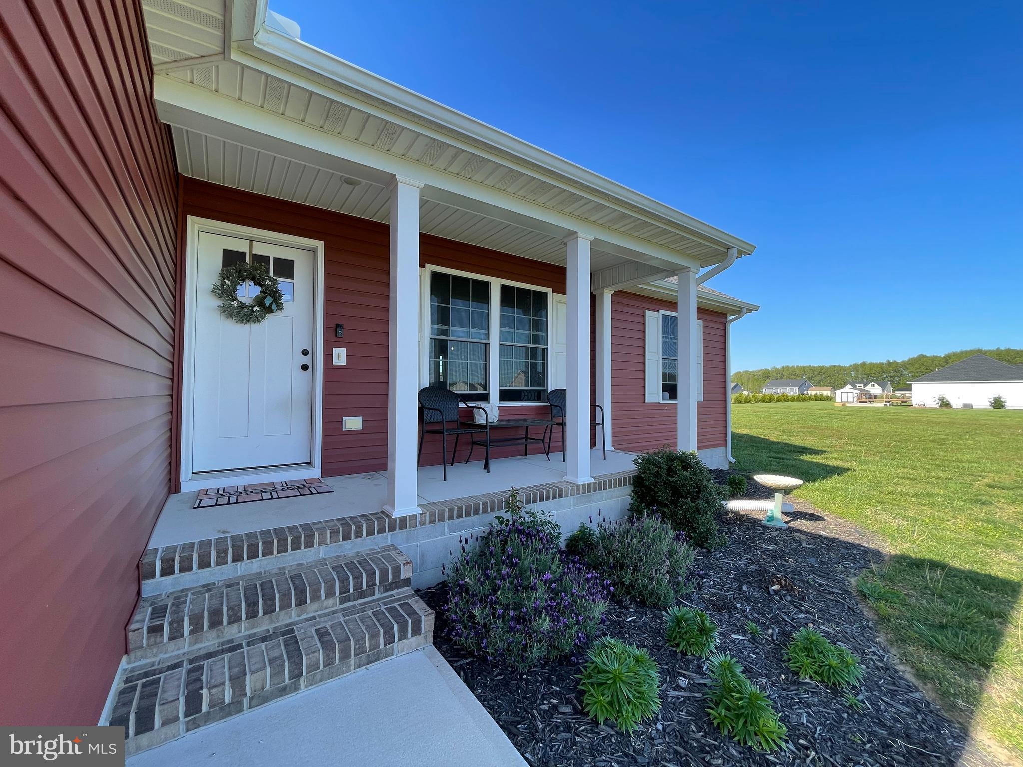 29389 Eagle Point Drive Seaford, DE 19973 - Photo 2 of 42 a view of a house with backyard and garden