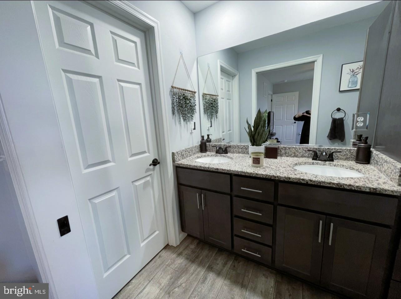 29389 Eagle Point Drive Seaford, DE 19973 - Photo 23 of 42 a bathroom with a granite countertop sink and a mirror
